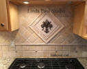 fleur de lis mosaic tile and metal medallion