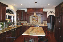 tuscan kichen with cherry cabinets and granite island