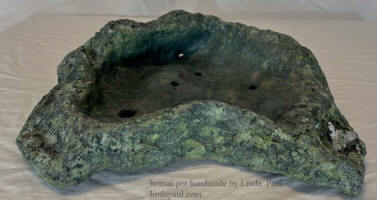 green and gray bonsai pot with crystals