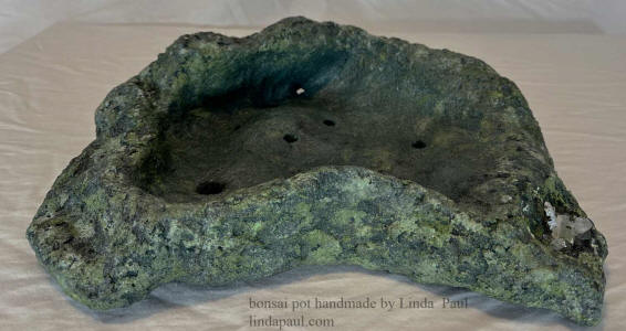 green and gray bonsai pot with crystals